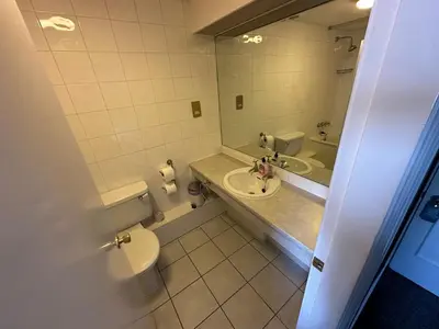a bathroom with a sink and a toilet and a mirror at Clarkes Hotel Barrow in Furness in Barrow in Furness