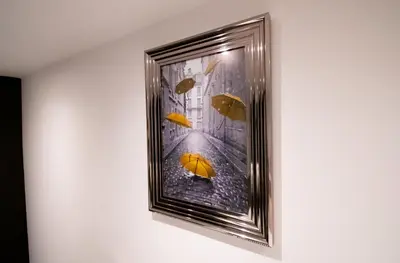a picture of an orange umbrella in the rain at Winter Gardens Suites by Sasco in Blackpool