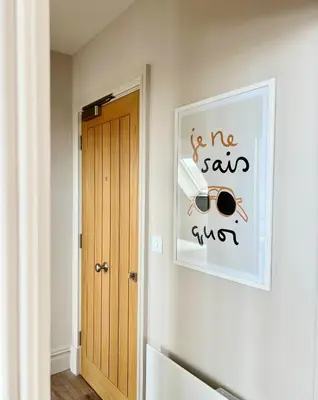 a room with a picture of a pair of sunglasses on the wall at The Apartments Lytham Square in Lytham St Annes