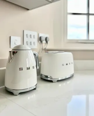 two toasters sitting on a counter in a kitchen at The Apartments Lytham Square in Lytham St Annes