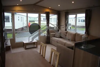 a living room with a couch and a table at Tranquility - Static Caravan Lune Park on Parkdean Ocean Edge Resort in Heysham
