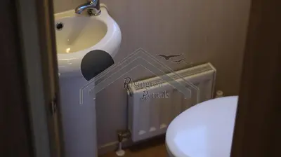 a bathroom with a sink and a toilet at Tranquility - Static Caravan Lune Park on Parkdean Ocean Edge Resort in Heysham