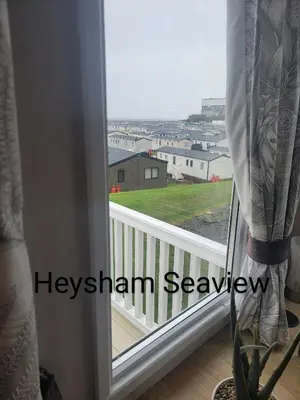 a window with a view of a balcony at Heysham seaview in Heysham