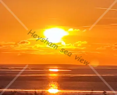 a sunset over the ocean with the wordshappy naughty sea view at Heysham seaview in Heysham