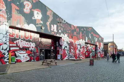 a building with graffiti on the side of it at Stunning Mersey View Flat w Parking in Liverpool in Liverpool