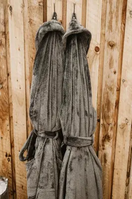 a statue of two umbrellas hanging on a wall at The Old Brewery in Ulverston