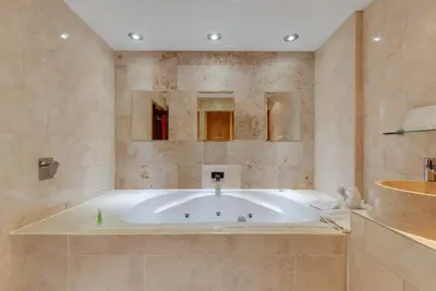 a large bathroom with a tub in a room at Boutique 56 in Liverpool