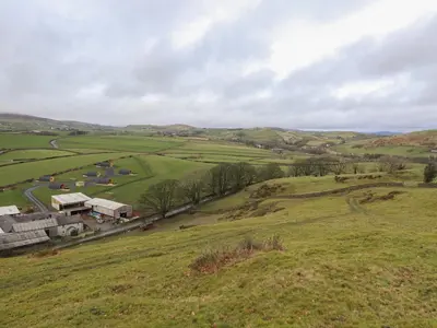 an aerial view of a farm in a field at Rowan in Ulverston