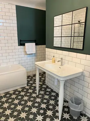 a bathroom with a sink and a toilet and a tub at Beautiful Victorian Townhouse in Liverpool