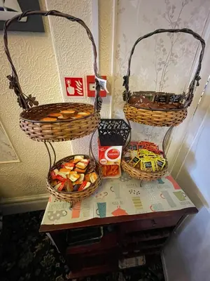 two baskets on a table with some snacks on it at Nevele in Blackpool