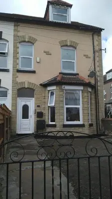 a house with a gate in front of it at RUDGRAVE SQUARE WALLASEY in Wallasey