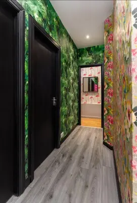 a hallway with a door to a room with green walls at Luxury Mirror Party Pad with 4 Bedrooms! in Liverpool