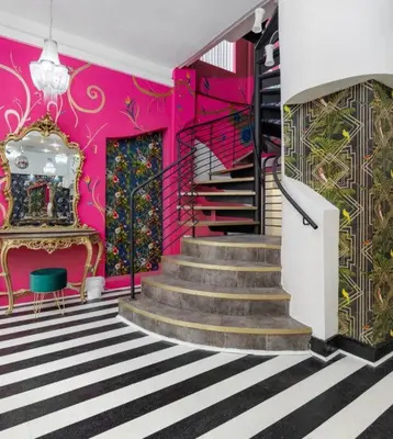 a staircase in a room with pink walls at Luxury Mirror Party Pad with 4 Bedrooms! in Liverpool