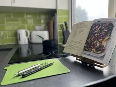 a book sitting on top of a counter with two pens at Modern 1 bed studios for comfy stay in Preston in Preston