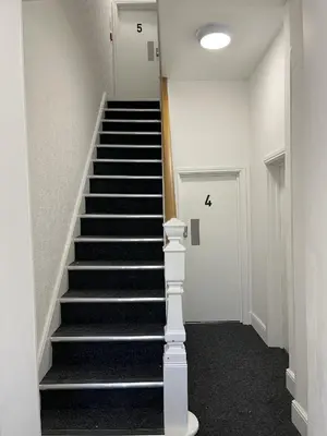 a staircase in a building with the number on it at Modern 1 bed studios for comfy stay in Preston in Preston