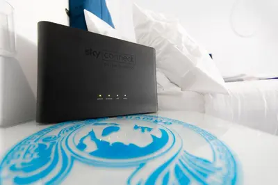 a laptop computer sitting on top of a table at The New Apollo Hotel in Blackpool