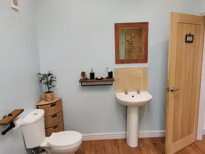 a bathroom with a toilet and a sink at The Bakery in Pilling