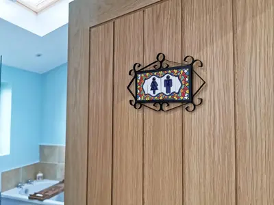 a plaque on a wooden door with the number forty on it at The Bakery in Pilling