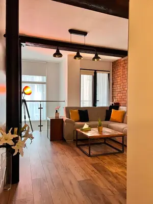 a living room with a couch and a table at Stunning Liverpool City Center Apartment in Liverpool