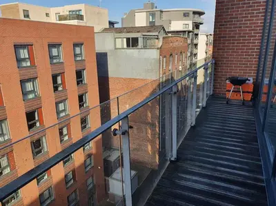 a view of a stairway in a city with buildings at Lovely Modern Central & Spacious in Liverpool