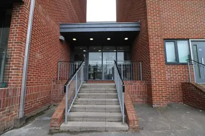 a staircase leading into a brick building with a door at Lovely Modern Central & Spacious in Liverpool