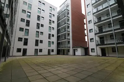 an empty courtyard in an apartment building at Lovely Modern Central & Spacious in Liverpool