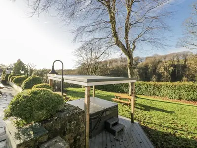 a picnic table in a park with a tree at Valley View in Dalton in Furness