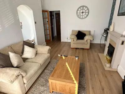 a living room with a couch and a coffee table at Spacious one bedroom apartment in central location in Lytham St Annes