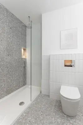 a bathroom with a glass shower and a toilet at 40 Renshaw Apartments in Liverpool
