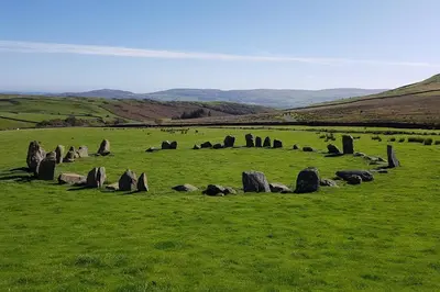 a group of rocks in a field with green grass at Halsteads: peaceful location, stunning views in Soutergate