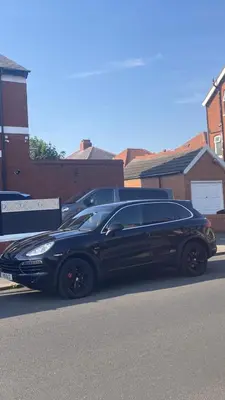 a black limo parked on the side of a street at Danny holiday home in Blackpool