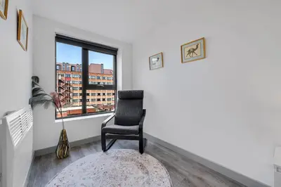 a living room with a chair and a window at Host & Stay - The Roscoe Nest in Liverpool
