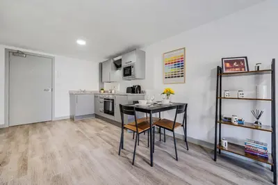 a kitchen with a table and chairs in a room at Host & Stay - The Roscoe Nest in Liverpool