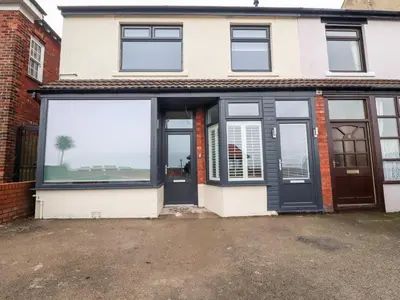 a house with large windows and a door at Ferry View in Fleetwood