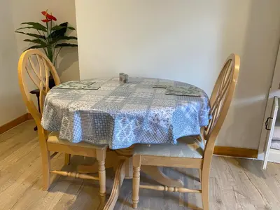 a table with a blue and white table cloth on it at The Cellar on Hornby in Morecambe