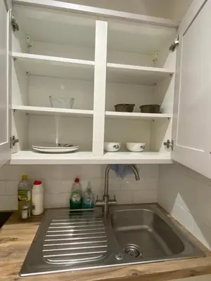 a kitchen with a sink and a counter top at The Cellar on Hornby in Morecambe