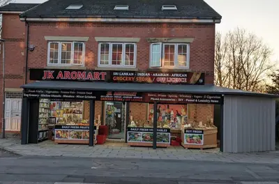 a k arrows grocery store on a city street at Jey's Flat in Liverpool