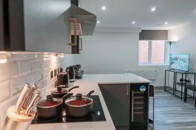 a kitchen with two pots on top of a stove at Lovely 1 Bedroom Apartment in Preston in Preston
