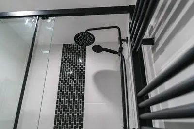 a shower in a bathroom with a black and white at Lovely 1 Bedroom Apartment in Preston in Preston