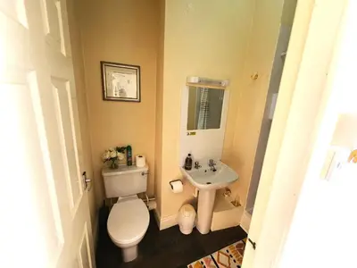 a small bathroom with a toilet and a sink at Windsor House Hotel in Blackpool