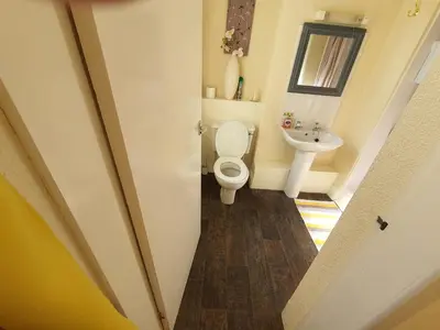 a bathroom with a toilet and a sink at Windsor House Hotel in Blackpool