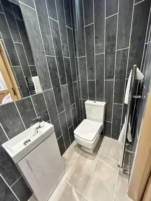 a bathroom with a toilet and a sink at Strawberry Fields Suite by Sasco Apartments in Blackpool
