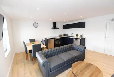 a living room with a couch and a table at No 10 Apartments in Blackpool