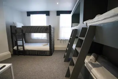 a room with two bunk beds and a window at The Breckfield Hotel in Liverpool