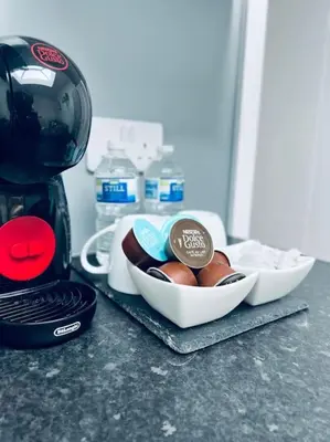 a counter with a bowl of eggs and a coffee maker at Contemporary studio apartment in Pemberton