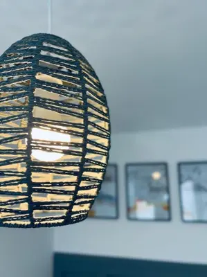 a light hanging from a ceiling in a room at Contemporary studio apartment in Pemberton