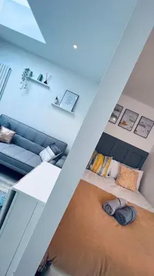 an overhead view of a living room with a couch at Contemporary studio apartment in Pemberton