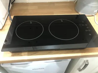 a stove top oven sitting on top of a counter at A secluded Garden Room in sunny Southport in Southport