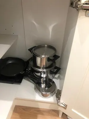 a pot and a pan on a shelf in a room at A secluded Garden Room in sunny Southport in Southport