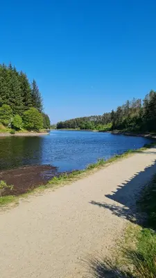 a beach next to a body of water at Cadshaw Country Views in Darwen